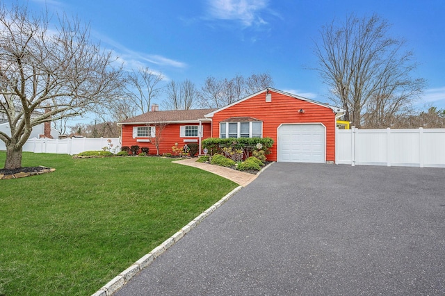 24 Thomas St, Coram, NY 11727 - view of front of property featuring a garage, a chimney, and driveway