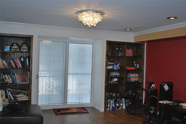 office space with wood finished floors, ornamental molding, and a chandelier