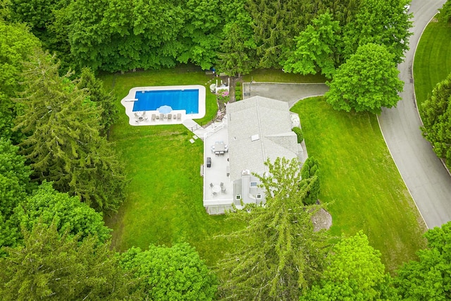 aerial view of property and surrounding area with a pool