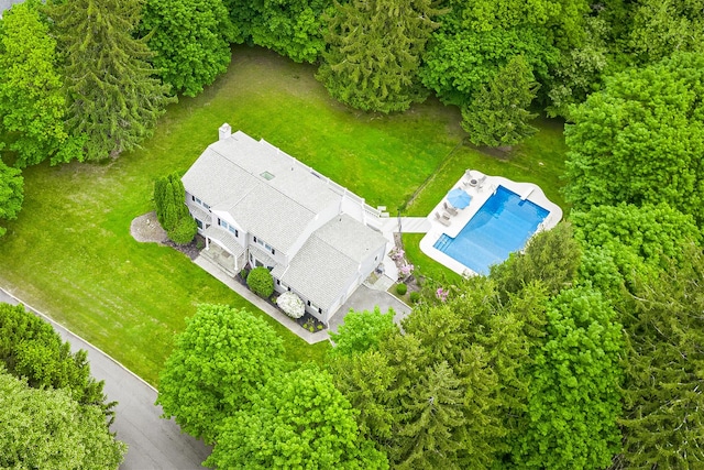 view of subject property featuring a pool area