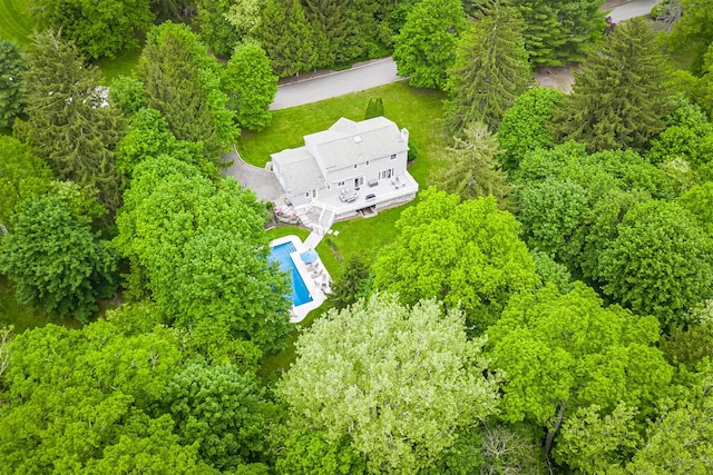 aerial view of property and surrounding area featuring a pool