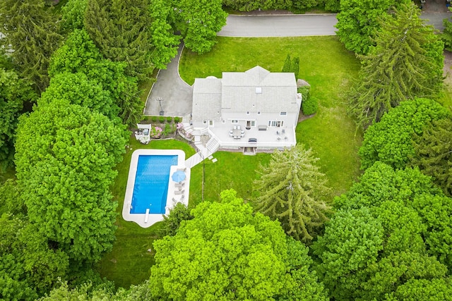 aerial view of property and surrounding area featuring a pool