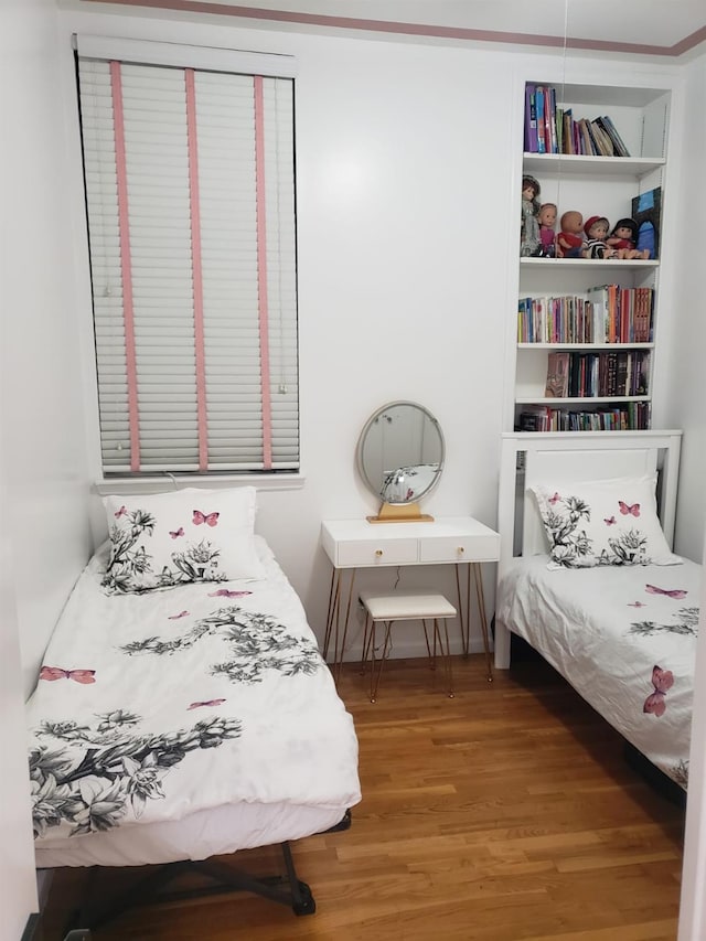 bedroom featuring wood finished floors