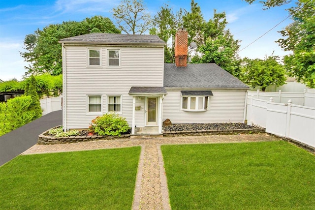 680 Corbalis Pl, Yonkers, NY 10703 - view of front facade featuring a chimney and a shingled roof