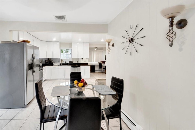680 Corbalis Pl, Yonkers, NY 10703 - dining area featuring baseboard heating and light tile patterned floors