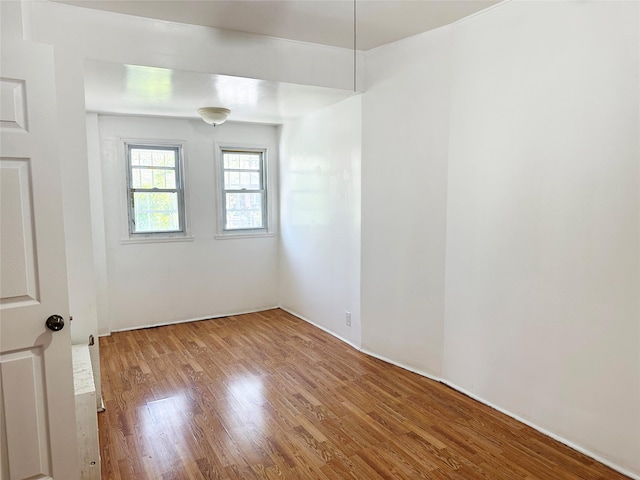unfurnished room featuring wood finished floors