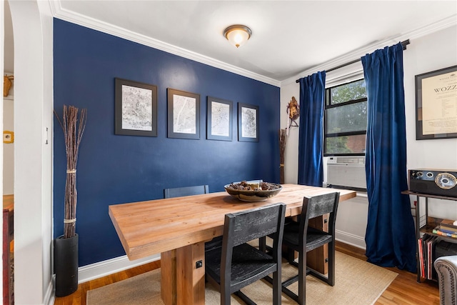 316 Richbell Rd Unit C2, Mamaroneck, NY 10543 - dining area featuring wood finished floors, crown molding, cooling unit, and baseboards