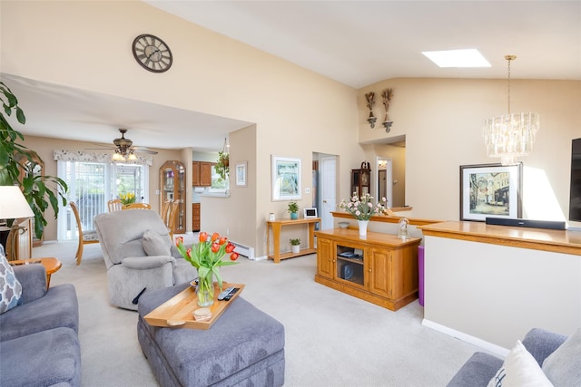 living room with a chandelier, light colored carpet, a baseboard heating unit, baseboards, and ceiling fan
