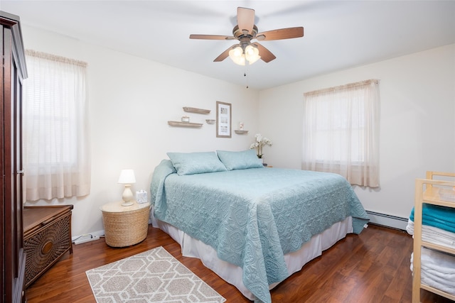 bedroom with a baseboard radiator, wood finished floors, and ceiling fan