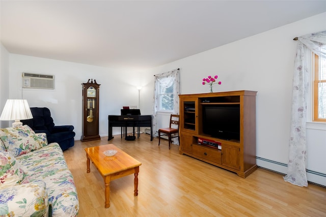 living room with light wood-type flooring and a wall mounted AC