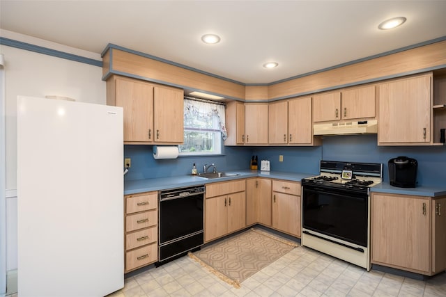 kitchen featuring gas stove, black dishwasher, freestanding refrigerator, under cabinet range hood, and light brown cabinetry