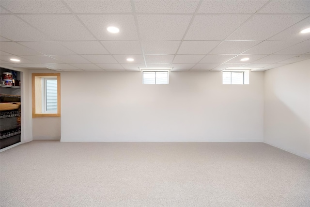 basement featuring carpet flooring, recessed lighting, and a paneled ceiling