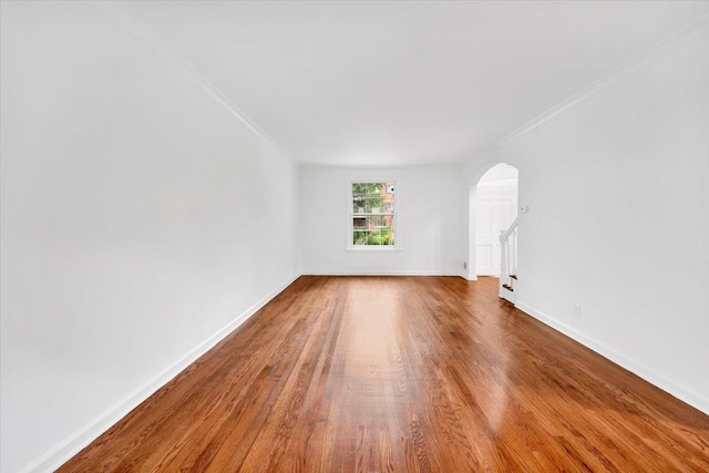 2356 Palmer Ave, New Rochelle, NY 10801 - unfurnished room with arched walkways, crown molding, and wood finished floors