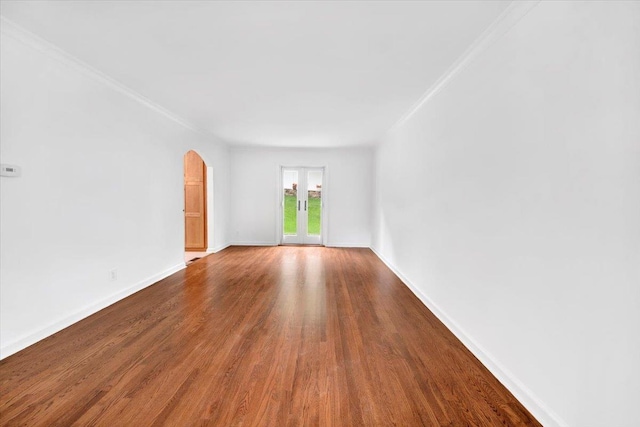 2356 Palmer Ave, New Rochelle, NY 10801 - spare room with wood finished floors, arched walkways, and crown molding