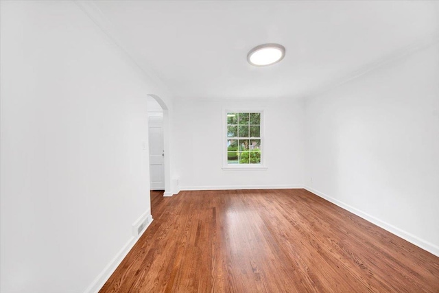 2356 Palmer Ave, New Rochelle, NY 10801 - spare room featuring arched walkways and wood finished floors