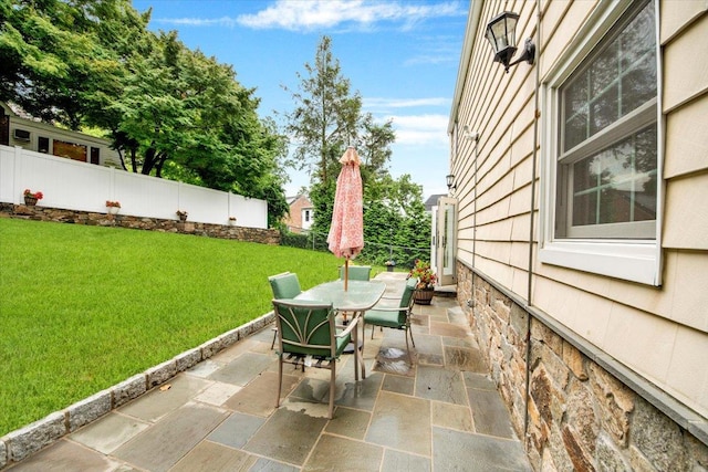 2356 Palmer Ave, New Rochelle, NY 10801 - fenced backyard with outdoor dining space and a patio