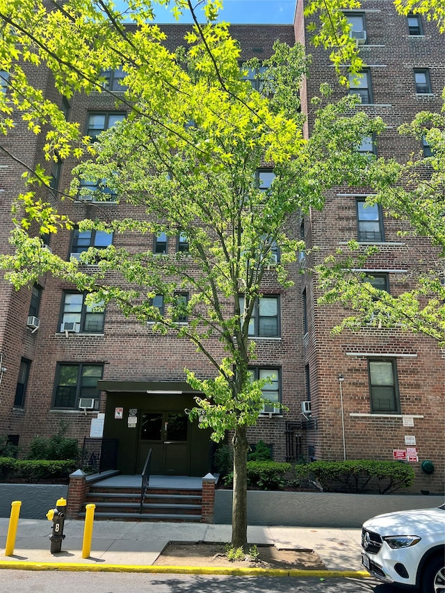 88-30 182nd St Unit 6F, Hollis, NY 11423 - view of apartment building / complex featuring cooling unit
