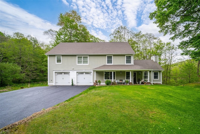 444 Haviland Hollow Rd, Patterson, NY 12563 - view of front of property featuring driveway, a porch, a chimney, an attached garage, and a front yard