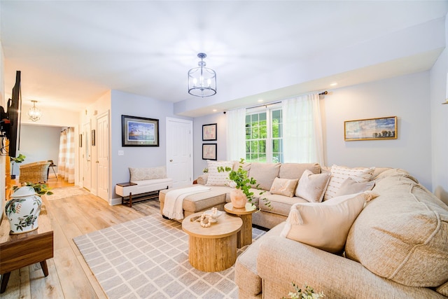 444 Haviland Hollow Rd, Patterson, NY 12563 - living room with a chandelier and light wood-style flooring