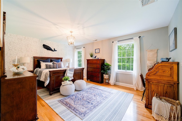 444 Haviland Hollow Rd, Patterson, NY 12563 - bedroom featuring light wood finished floors, a chandelier, and baseboards