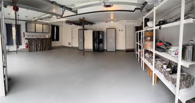 444 Haviland Hollow Rd, Patterson, NY 12563 - garage featuring black refrigerator with ice dispenser