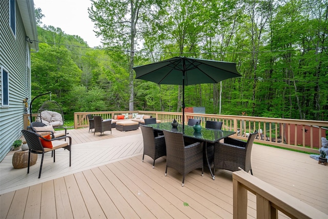 444 Haviland Hollow Rd, Patterson, NY 12563 - wooden deck with outdoor lounge area, outdoor dining space, and a wooded view