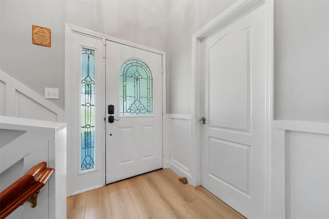 50 Old Dutch Hollow Rd, Monroe, NY 10950 - foyer featuring light wood finished floors, a decorative wall, and wainscoting