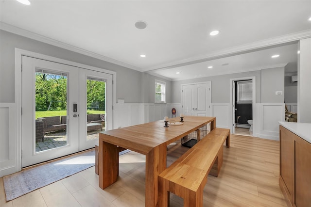 50 Old Dutch Hollow Rd, Monroe, NY 10950 - dining room featuring french doors, a decorative wall, a wainscoted wall, crown molding, and light wood finished floors