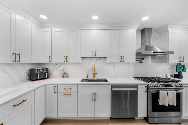 50 Old Dutch Hollow Rd, Monroe, NY 10950 - kitchen featuring wall chimney exhaust hood, appliances with stainless steel finishes, white cabinets, tasteful backsplash, and light stone counters