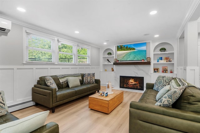 50 Old Dutch Hollow Rd, Monroe, NY 10950 - living area with built in shelves, light wood finished floors, a high end fireplace, a baseboard heating unit, and a wall mounted air conditioner