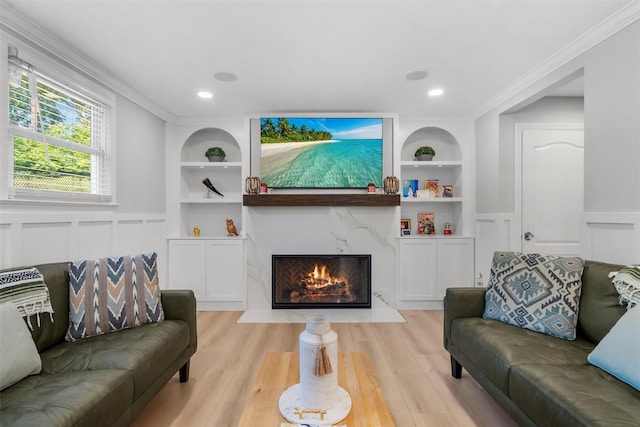 50 Old Dutch Hollow Rd, Monroe, NY 10950 - living area with built in shelves, crown molding, light wood-style floors, a decorative wall, and wainscoting