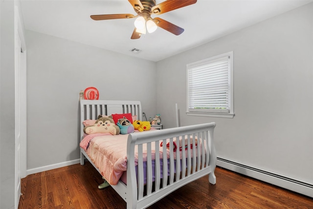 50 Old Dutch Hollow Rd, Monroe, NY 10950 - bedroom with a baseboard heating unit, wood finished floors, and ceiling fan
