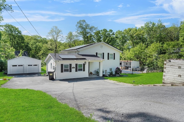 50 Old Dutch Hollow Rd, Monroe, NY 10950 - split level home with an outdoor structure, roof mounted solar panels, a front yard, a garage, and a shingled roof