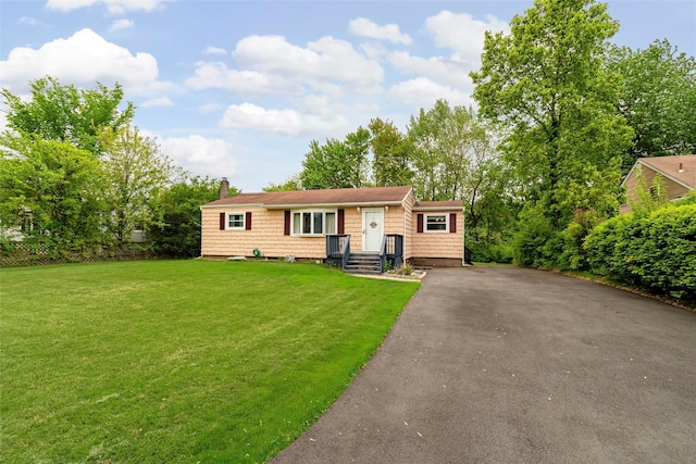21 James Rd, Monroe, NY 10950 - view of front facade with driveway, a chimney, and a front yard