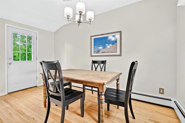 21 James Rd, Monroe, NY 10950 - dining space with a chandelier, vaulted ceiling, light wood-style flooring, and baseboards