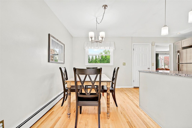21 James Rd, Monroe, NY 10950 - dining room with a baseboard heating unit, light wood-style floors, a chandelier, and baseboards