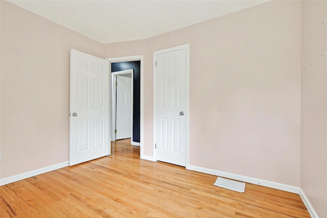 21 James Rd, Monroe, NY 10950 - unfurnished bedroom with light wood-style flooring and baseboards