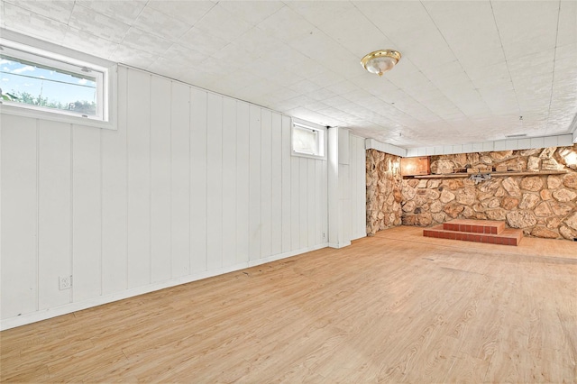 21 James Rd, Monroe, NY 10950 - basement featuring wood finished floors, healthy amount of natural light, and wooden walls
