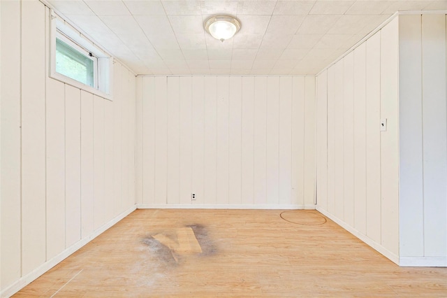 21 James Rd, Monroe, NY 10950 - basement featuring wood finished floors, wooden walls, and baseboards