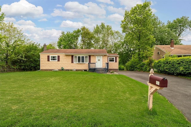 21 James Rd, Monroe, NY 10950 - view of front of home with driveway, a front yard, and a chimney