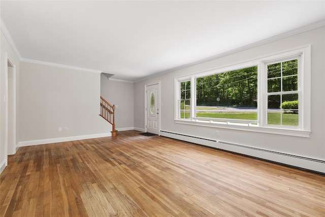 23 Entrance Way, Purdys, NY 10578 - unfurnished living room featuring stairs, hardwood / wood-style floors, a baseboard heating unit, ornamental molding, and baseboards