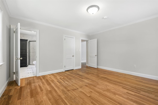 23 Entrance Way, Purdys, NY 10578 - unfurnished bedroom featuring light wood-style floors, crown molding, baseboards, and ensuite bath