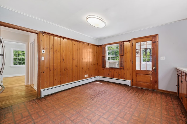 23 Entrance Way, Purdys, NY 10578 - spare room featuring brick patterned floors, plenty of natural light, baseboards, a baseboard heating unit, and crown molding