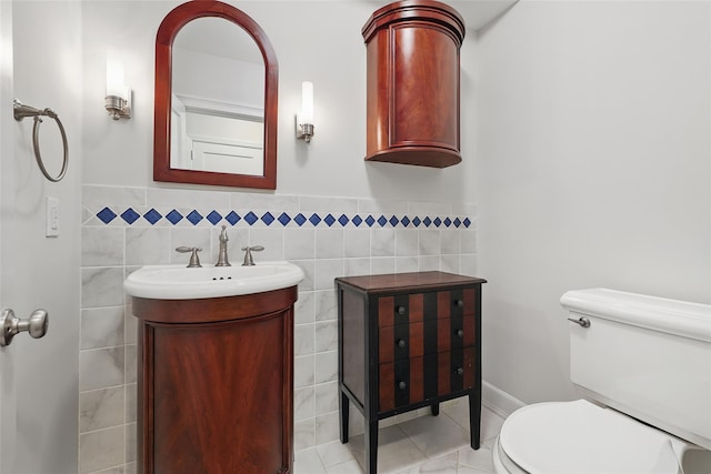 23 Entrance Way, Purdys, NY 10578 - half bath with toilet, vanity, tile walls, and tile patterned floors