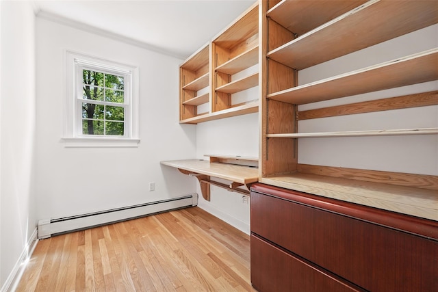 23 Entrance Way, Purdys, NY 10578 - unfurnished office with baseboard heating, built in study area, light wood-type flooring, crown molding, and baseboards