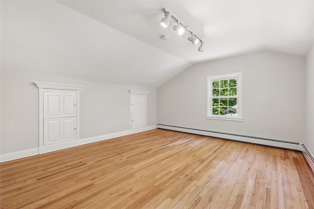 23 Entrance Way, Purdys, NY 10578 - additional living space featuring lofted ceiling, light wood finished floors, a baseboard heating unit, and baseboards