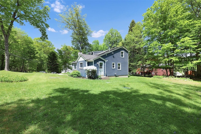 23 Entrance Way, Purdys, NY 10578 - rear view of house with a yard