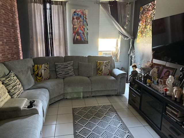 living room featuring light tile patterned flooring
