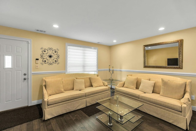living area with wood finished floors, baseboards, and recessed lighting