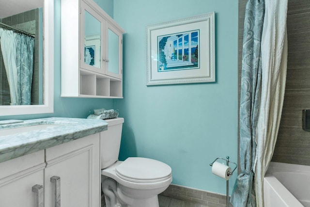 full bathroom featuring vanity and toilet